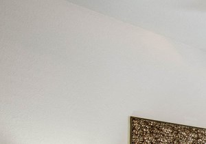 Bedroom with plush carpet, ceiling fan, and large window